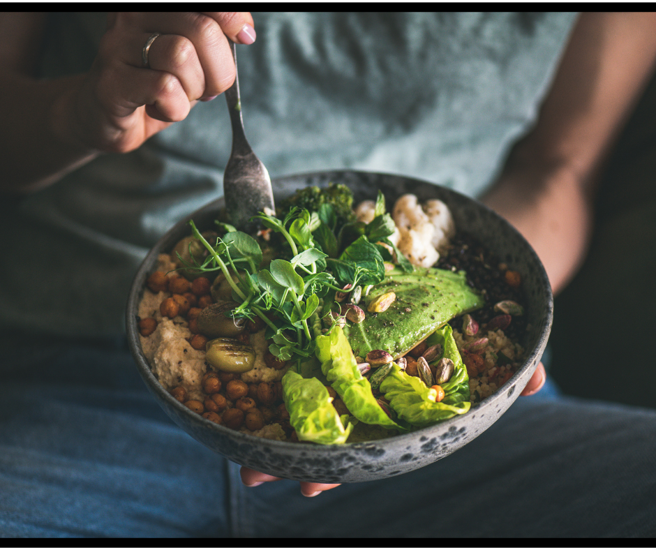 A person holding a plant-based meal